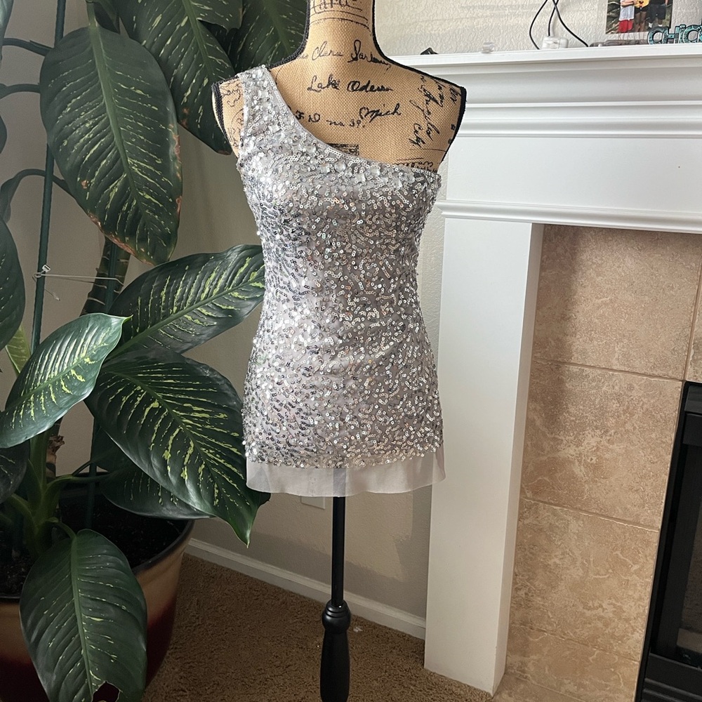 Body Central Glamorous One-Shoulder Silver top Dazzle in this